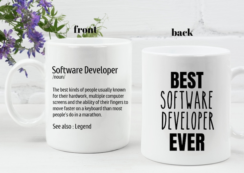 May include: White ceramic mug with the text "Software Developer" and a definition on one side, and "BEST SOFTWARE DEVELOPER EVER" on the other. The mug has a handle and is suitable for hot beverages.