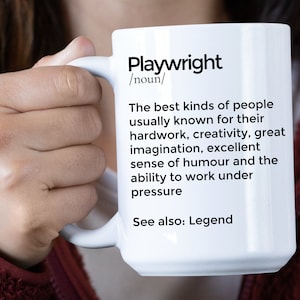 May include: White ceramic mug with a black and white definition of the word "Playwright". The definition reads: "The best kinds of people usually known for their hard work, creativity, great imagination, excellent sense of humour and the ability to work under pressure. See also: Legend."