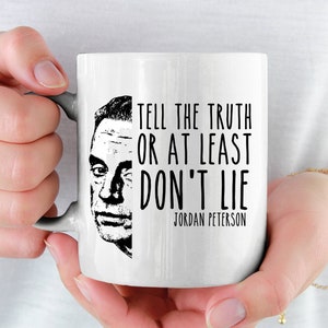 May include: White ceramic mug with a black and white image of Jordan Peterson and the quote "Tell the truth or at least don't lie".