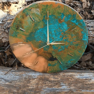 Farmhouse Handmade Old Copper Wall Clock with Gold Colored Hands on a natural wooden background under natural sunlight by Copper Empire