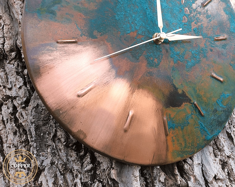 Industrial Handmade Old Copper Wall Clock with Silver Colored Hands hanging on a tree under natural sunlight by Copper Empire