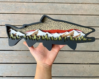 Wood Rainbow trout .Snow capped mountains with pine trees. Fishing and outdoor enthusiasts. Fly fishing. Fishing home decor. Fishing gift