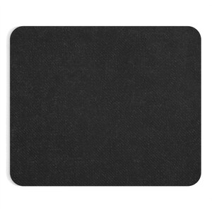 May include: A black mouse pad with a textured surface.
