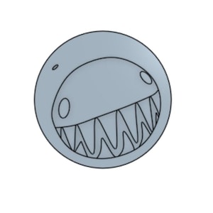 May include: A light gray, circular design featuring a stylized, toothy grin. The design has a cartoonish aesthetic, with a curved upper edge and a detailed outline of the mouth and teeth. The overall shape is a perfect circle.