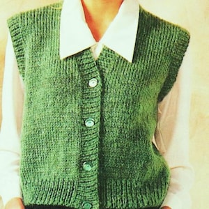 May include: A green knitted waistcoat with a button-up front. The waistcoat has a V-neck and is sleeveless.