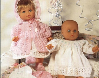 May include: Two knitted doll outfits, one pink and one white, with matching shoes. The outfits are designed for dolls and premature babies. The text "For Dolls and Premature" is visible in the image.