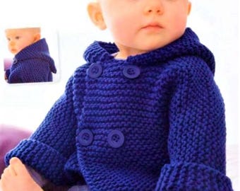 May include: A blue knitted baby cardigan with a hood and two buttons. The cardigan has a ribbed texture and is made with a soft yarn.