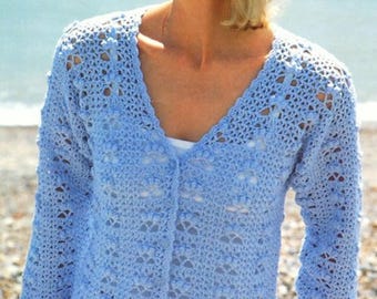 May include: A light blue crocheted cardigan with a button closure and a delicate openwork pattern. The cardigan has long sleeves and a v-neck.