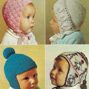May include: Four different knitted baby hats with ear flaps. The hats are in pink, white, blue, and gray with white, red, and black accents. The hats are all made with a simple stitch pattern.