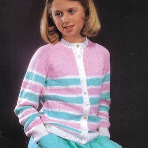 May include: A pink and blue striped cardigan with white buttons. The cardigan is knitted and has a crew neck.