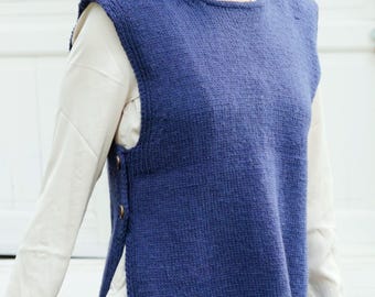 May include: A blue knitted sleeveless vest with a round neckline and button closures on the sides.