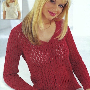 May include: A red crocheted cardigan with a v-neck and long sleeves. The cardigan has a button closure and a delicate lace pattern.