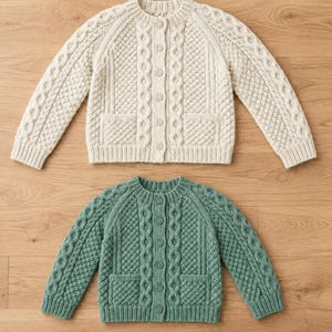 May include: Two long-sleeve knit cardigans, one cream and one sage green, featuring a round neckline, a vertical button-down front, two front pockets, and a textured pattern of cable knit and diamond stitches on the front and sleeves.