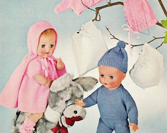 May include: Knitting pattern for doll clothes, featuring a pink dress with a cape, a blue knitted outfit, and a white knitted dress. The pattern is for 4-ply yarn and is suitable for 18 or 20 inch dolls. The pattern is from Bellmans Wools.