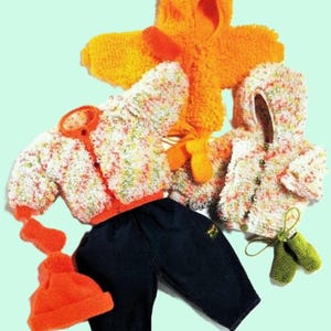 May include: A set of knitted baby clothes in orange, white, and green. The set includes a hooded jacket, a sweater, a hat, and a pair of booties.