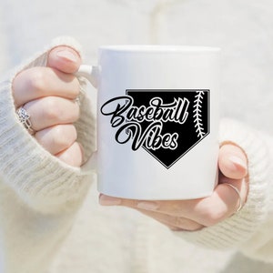 May include: White ceramic mug with a black baseball diamond graphic and the text "Baseball Vibes".