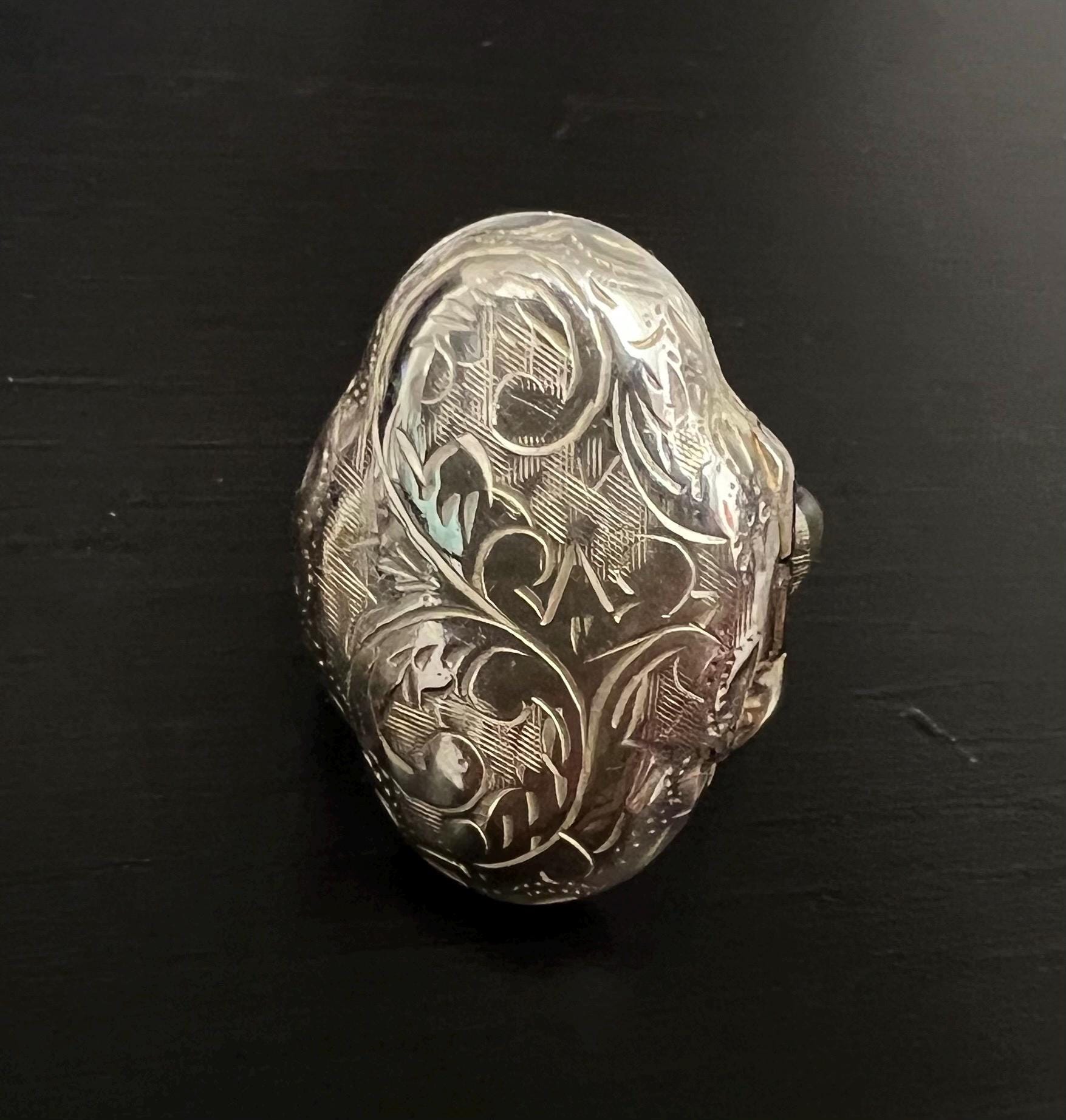 A very special vintage silver locket ring.