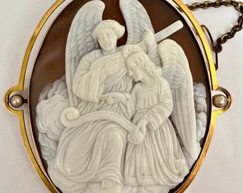 A very Beautiful Victorian 9k cameo brooch of an Angel playing a lute, with a second Angel holding the music.