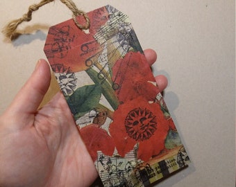 Decoupaged tag ~*~ featuring red flowers, astronomy stamped details, roses, and more ~*~ detailed and collaged by hand