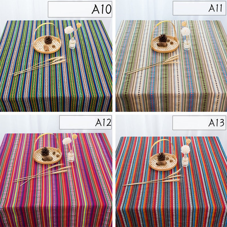 May include: Four different striped tablecloths with various color combinations. The tablecloths are made of a woven fabric with a subtle texture. The tablecloths are all rectangular and have a simple design.