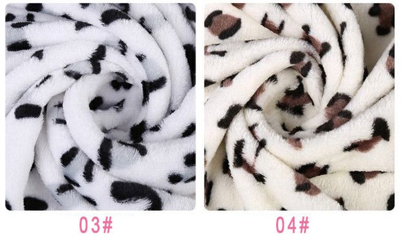 May include: Two close-up images of white fabric with a black and brown leopard print. The first image has a black print and the second image has a brown print.