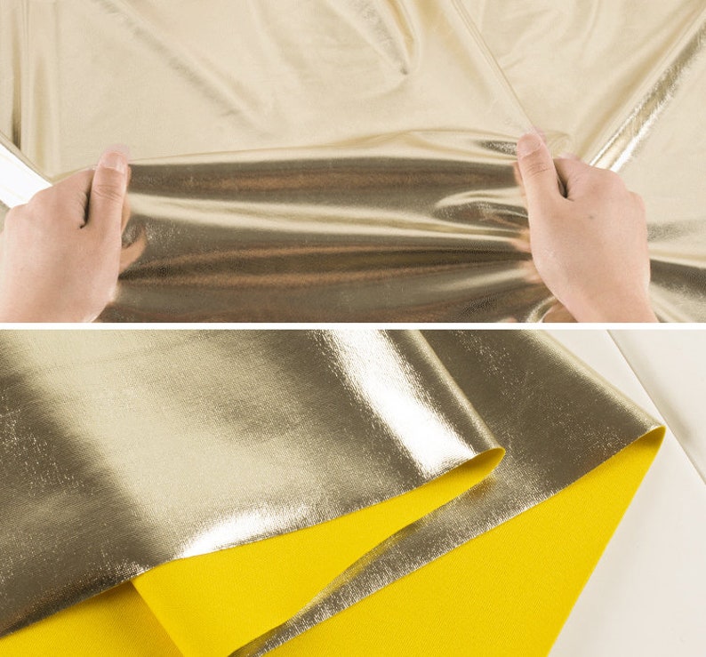 May include: Gold metallic fabric with a yellow backing. The fabric is folded in half and the metallic side is facing up.
