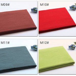 May include: Four fabric swatches in different colours: red, green, blue, and brown. The swatches are labelled with the codes M09#, M10#, M11#, and M12#.
