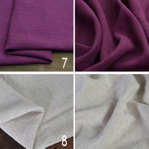 May include: Two fabric swatches, one a deep purple and the other a light beige. Both fabrics have a textured weave.