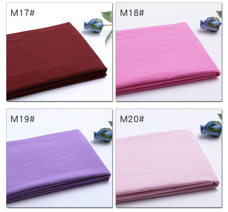 May include: Four fabric swatches in different colours: burgundy, pink, lavender, and light pink. Each swatch is folded in thirds and has a label with a number and the letter "M" in front of it. The labels read "M17", "M18", "M19", and "M20".