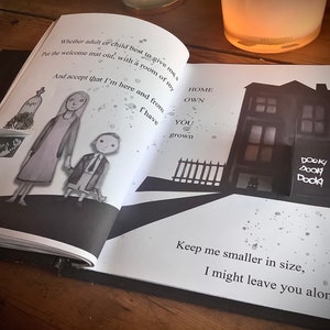 May include: A black and white illustration of a house with the words "Home Own You Grown" and "Dooky Dook Dook!" written on it. The illustration is on a page of a book with the text "Whether adult or child best to give me a Put the welcome mat out, with a room of my And accept that I'm here and from I have Keep me smaller in size, I might leave you alone" written on it.