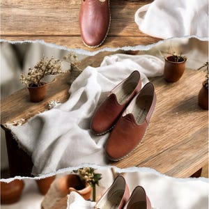 May include: A pair of brown leather slip-on shoes featuring a rounded toe, a low-cut topline, and visible light-colored stitching along the sole. The interior of the shoe includes a printed logo and text that reads "Handmade Fashion".