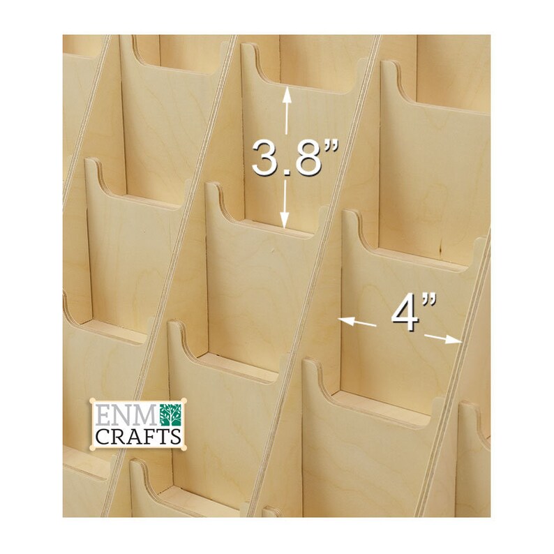 May include: A wooden card holder with 3.8 inch tall slots and 4 inch wide slots. The card holder is made of natural wood and has a light brown color.