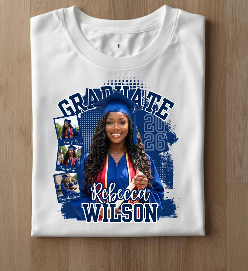 May include: White t-shirt featuring a graduation design. The design includes the word "GRADUATE" in navy blue, the year "2026", and the name "Rebecca Wilson". It also has three small photos of a graduate in a cap and gown.