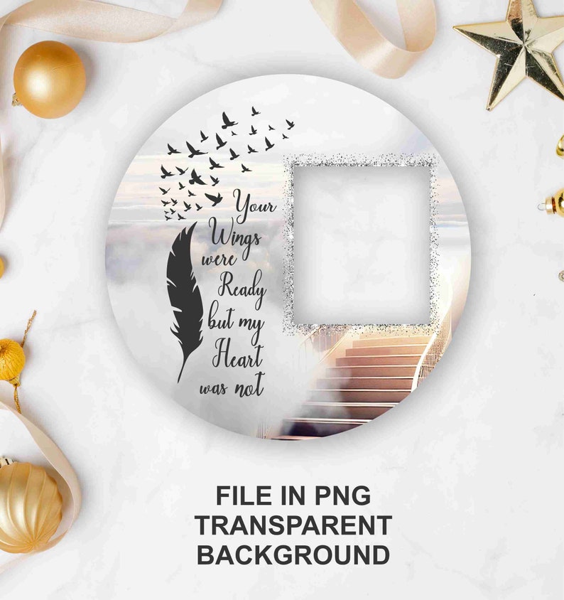 May include: A white circle with a photo frame, a feather, and birds flying upwards. The text reads "Your Wings were Ready but my Heart was not".