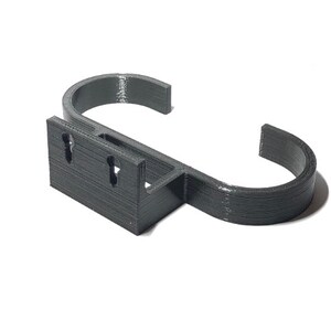 May include: A dark gray, 3D-printed wall hook. The hook has a rectangular base with two keyhole-shaped mounting holes and a curved, open hook design. The hook is designed to hold items and is made of a durable material.