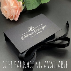 May include: A black gift box with a white ribbon and the text "Polina's Parelyjes - Bead Jewelry" printed on the top. The box is sitting on a gray surface.  GIFT PACKAGING AVAILABLE is printed in white on a black background.