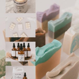 May include: A collection of handmade soaps, candles, and essential oil sprays. The soaps feature layered colors like teal, brown, and lavender. The candle is in a glass jar with the text "Vanilla Nut Coffee." Essential oil sprays are in amber bottles.