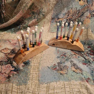 Natural wood pine marker holder with anchored marker caps