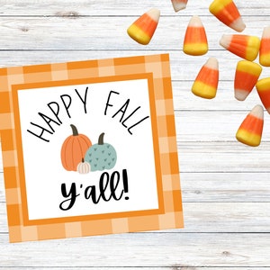 May include: Orange and white checkered gift tag with the text "Happy Fall y'all!" and a drawing of three pumpkins.