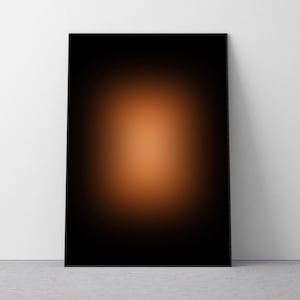 May include: A black framed print with a gradient background that transitions from dark black to a light orange in the centre.