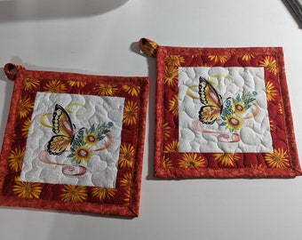 Pot Holders, set of 2, Hot Pads - Red/Orange with Embroidered Butterfly laurel, quilted with daisy quilted fabric with loop - 9 by 9 in