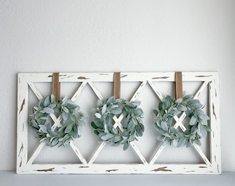 Farmhouse window frame with wreaths | window with wreaths | vintage wooden window frame | old chipped wood window frame