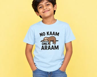 May include: A light blue short-sleeved t-shirt featuring a graphic of a brown sloth hanging on a branch. The text printed in black above and below the sloth reads NO KAAM ONLY ARAAM. The shirt has a crew neckline and a standard fit.