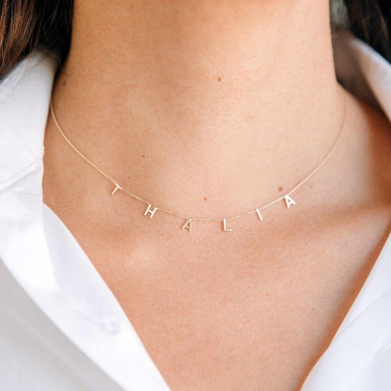 Necklace with letters of name clearance