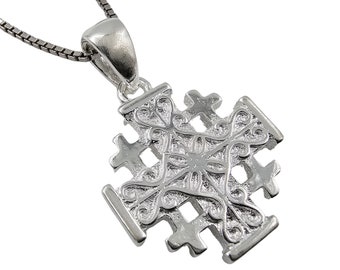 May include: Silver pendant necklace featuring a detailed Jerusalem cross design. The cross is intricately crafted with a floral pattern and a central heart.