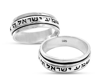 May include: A silver spinning ring with the Hebrew words "Shema Yisrael" engraved on the band.