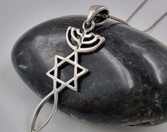 May include: A silver pendant necklace featuring a Star of David and a menorah. The pendant is hanging from a silver chain.