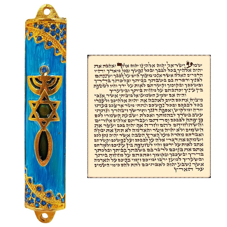 May include: A blue and gold mezuzah with a Star of David and menorah design. The mezuzah is decorated with rhinestones. The text on the scroll reads: "Shema Yisrael Adonai Eloheinu Adonai Echad."