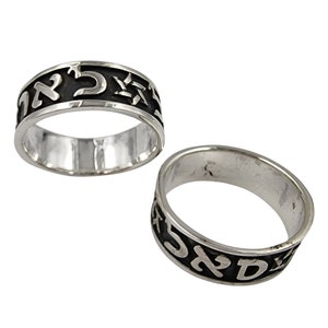 May include: Two silver rings with black Hebrew lettering. The rings are engraved with Hebrew characters and a Star of David.