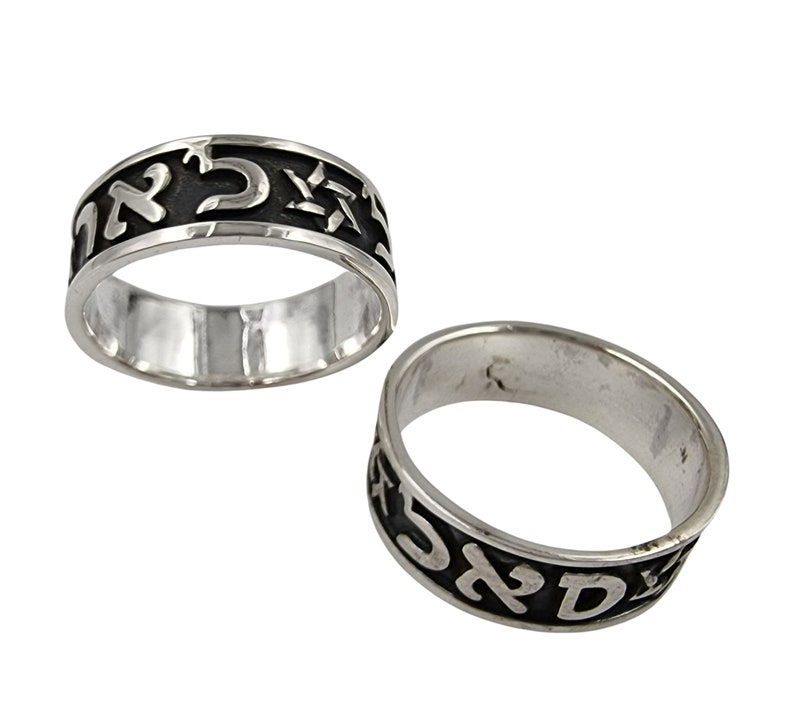 May include: Two silver rings with black Hebrew lettering. The rings are engraved with Hebrew characters and a Star of David.